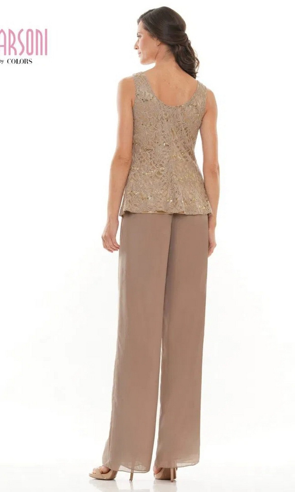 A woman stands facing away, wearing the Marsoni M305 Long Formal Pantsuit—sleeveless with gold patterns, chiffon pants, and heels—against a plain white background.